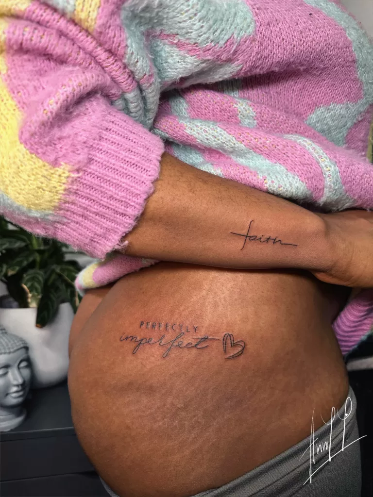 Fineline hip tattoo of script and heart