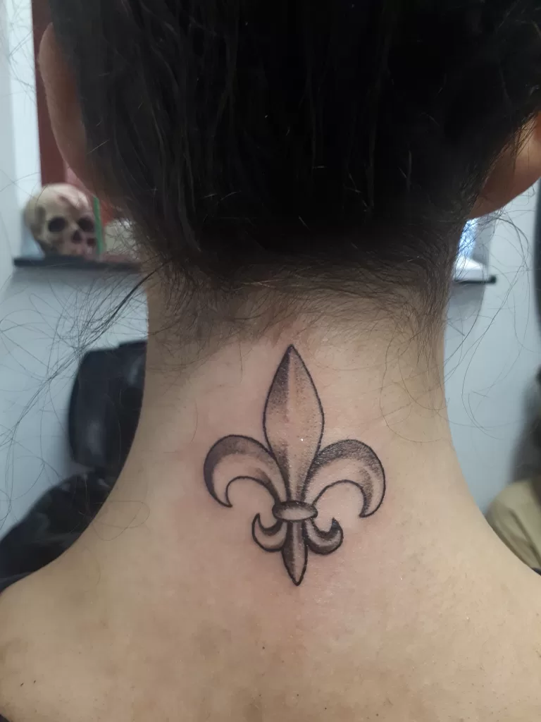 Fleur de lys tattoo on neck