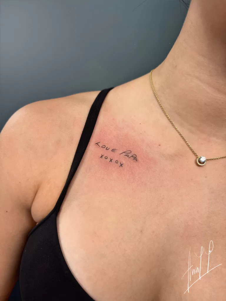 Fine line tattoo on collarbone