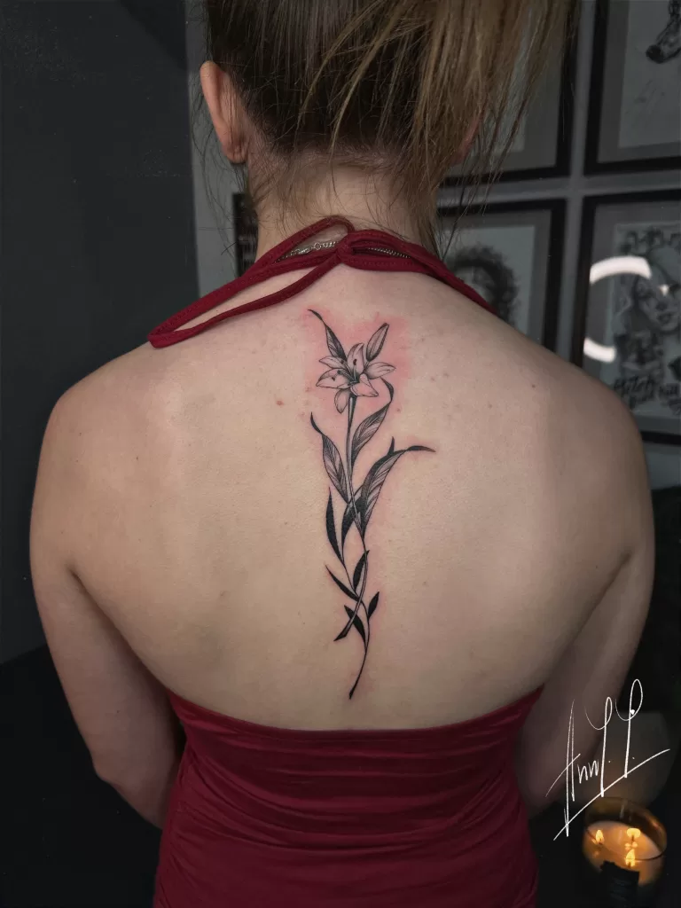 Floral spine tattoo