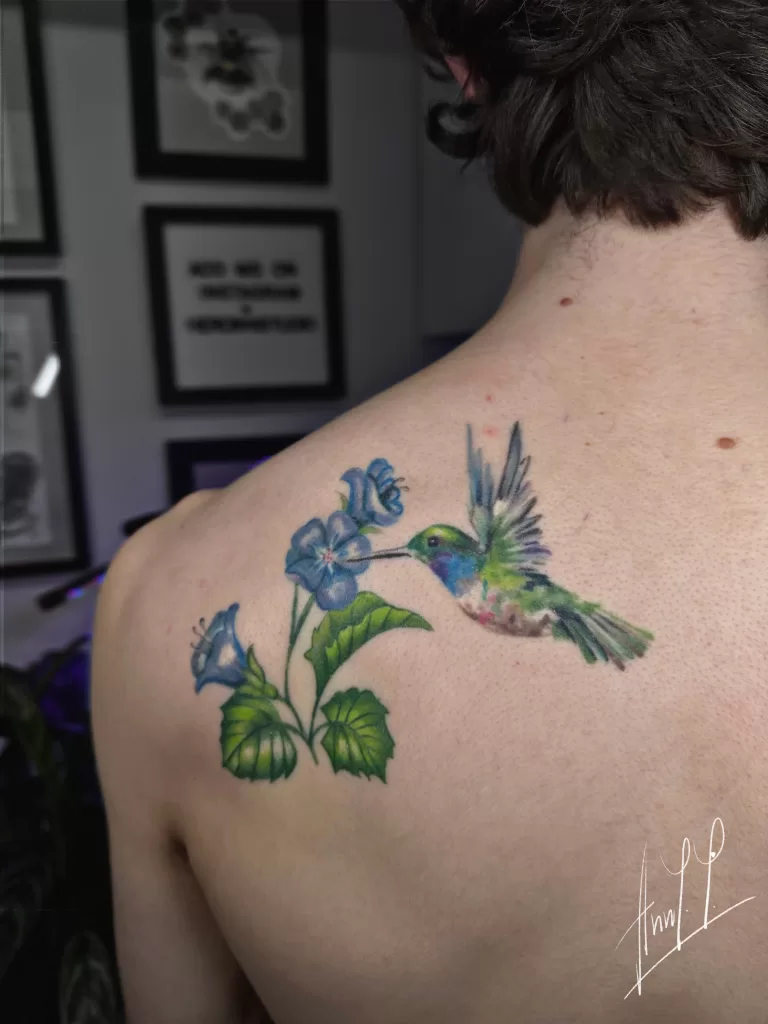 Full color realistic hummingbird and flowers