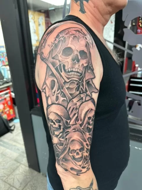 skulls and reaper half sleeve