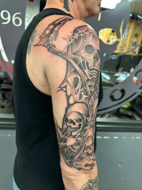 skulls and reaper half sleeve