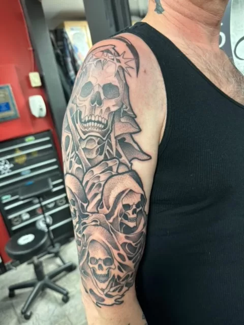 skulls and reaper half sleeve