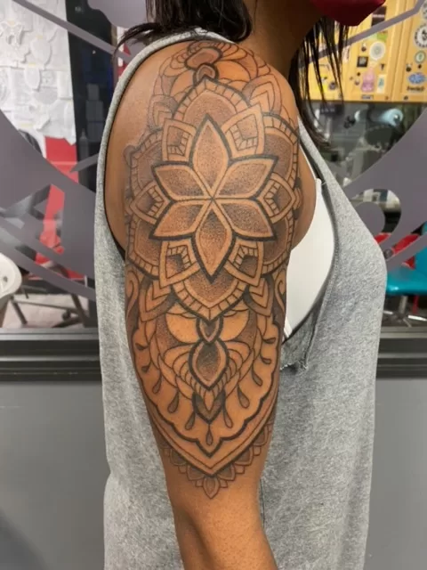 black and grey mandala tattoo