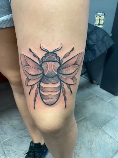 knee bug black and grey tattoo