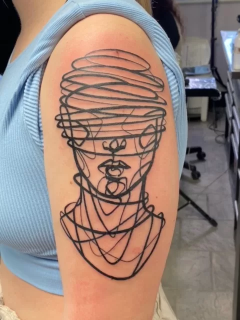 artistic head tattoo