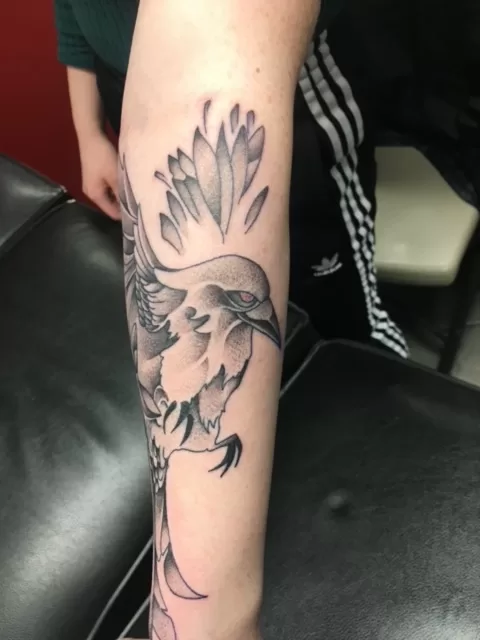 bird with flowers black and grey tattoo