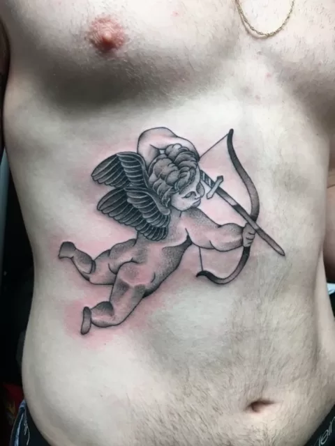 black and grey rib angel tattoo