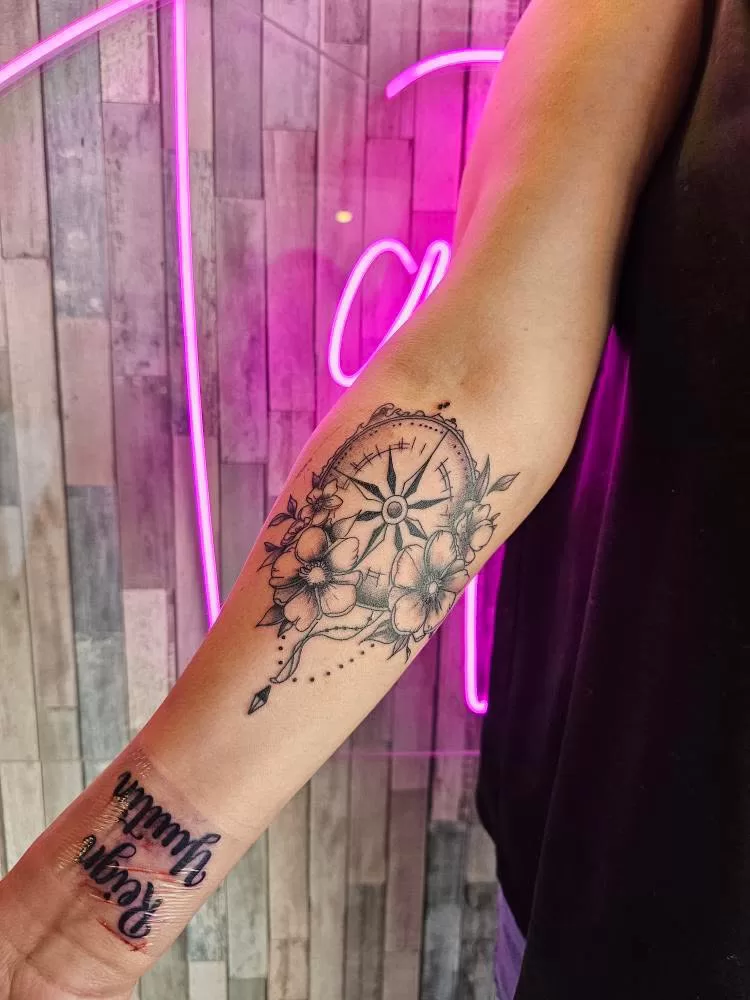 compass and flowers tattoo