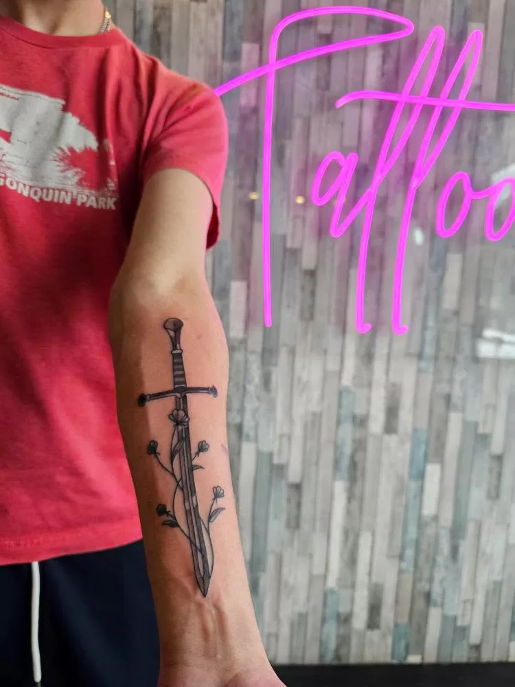 sword and flowers tattoo